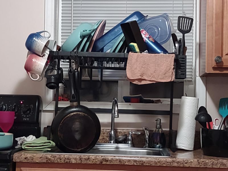 29 Kitchen "Icks" That Immediately Turn Off Homebuyers, According to Interior Designers - Decor Hint Crowded Dish Drying Rack