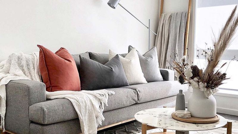 19 Layering Techniques That Make Any Room Feel Professionally Styled - Decor Hint Drape Throw Blankets Over Sofas or Chairs