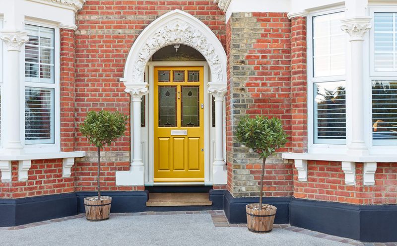 8 Curb Appeal Classics Michigan Homeowners Can't Stop Showing Off - Decor Hint Bold Front Doors That Make Statements