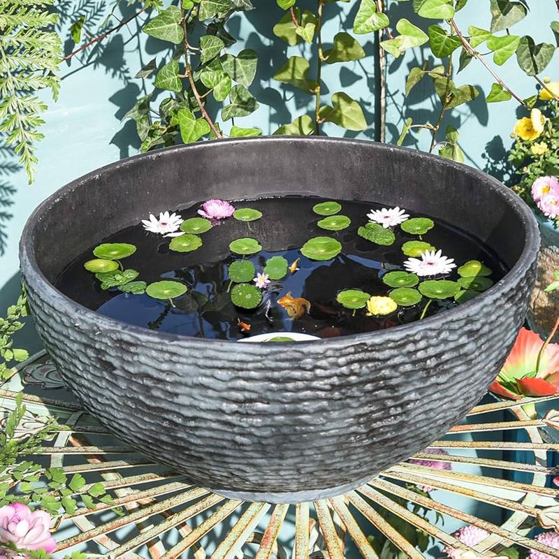 These 20 Garden Decor Ideas Are The Little Details That Will Make The Biggest Difference In Your Outdoor Space - Decor Hint Floating Water Plants in Containers