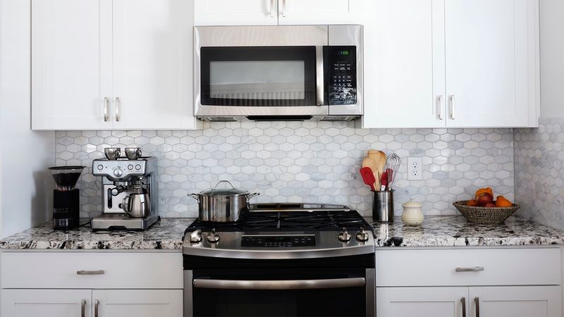 Design Experts Reveal: 10 Kitchen Turn-Offs Seen In California Homes - Decor Hint Microwave Placement Missteps