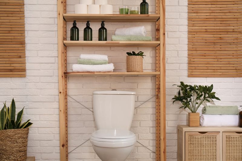19 Smart Ways To Use That Space Above The Toilet - Decor Hint Leaning Shelves For Visual Interest