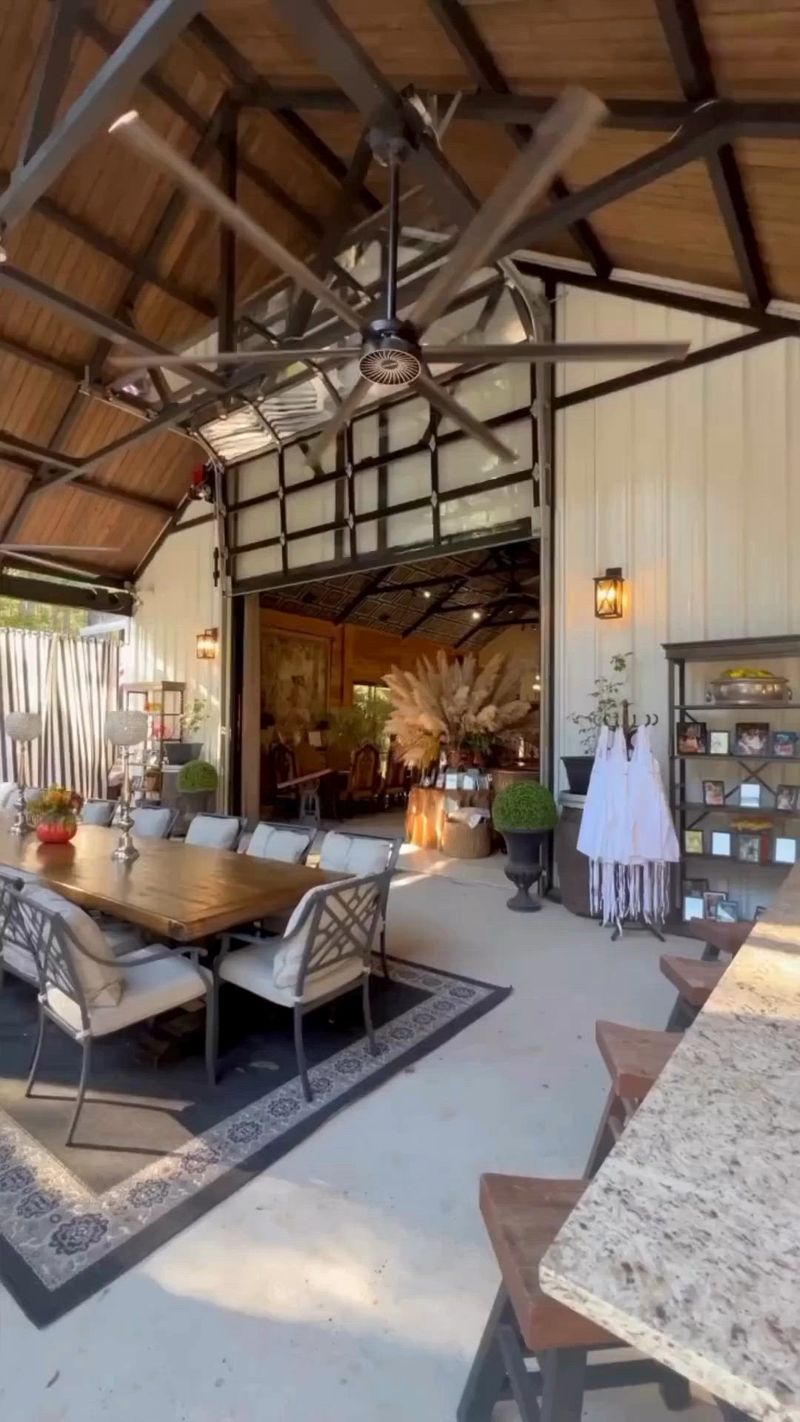 22 Fancy Barndominium Homes That Beautifully Mix Rustic With Modern - Decor Hint Glass Garage Doors to Outdoor Patio