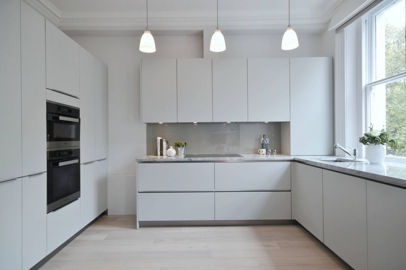 13 White Kitchens That Prove Minimalism Is Here To Stay - Decor Hint Integrated Appliances for Seamless Look