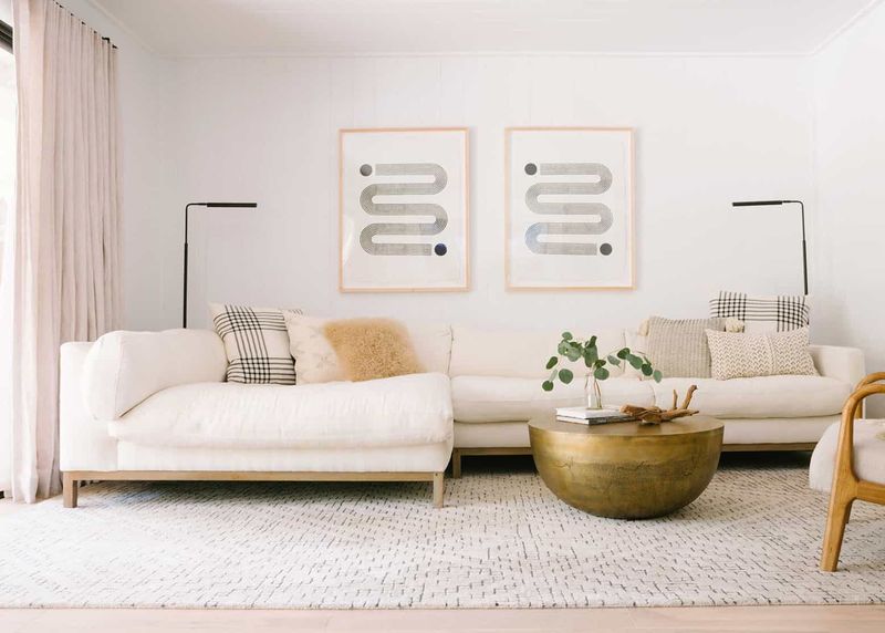7 Living Room Decorating Mistakes Everyone Makes, Interior Designers Say - Decor Hint Selecting the Wrong Size Rug