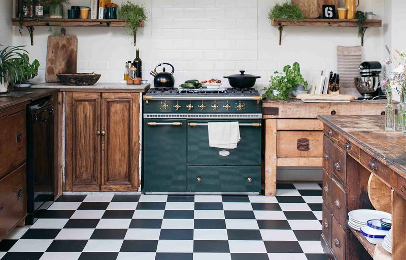 10 Kitchen Flooring Trends That Are Out In 2025 And 4 That Shouldn't Even Cross Your Mind - Decor Hint Black and White Checkerboard Tiles