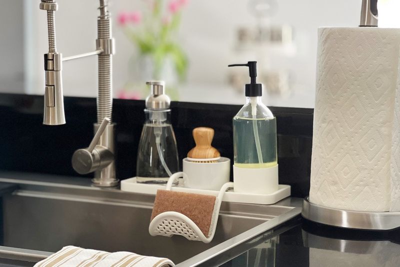 16 Items That Make Your Kitchen Look Cheap, According To Professionals (Plus 8 To Get Rid Of ASAP) - Decor Hint Sink Sponge and Dish Soap Display