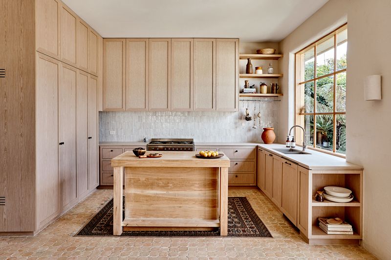 10 Earth-Toned Kitchens That Strike The Perfect Balance Between Modern & Timeless (Plus 10 That Are A Bad Choice) - Decor Hint Clay-Inspired Tiles With Clean White Cabinetry