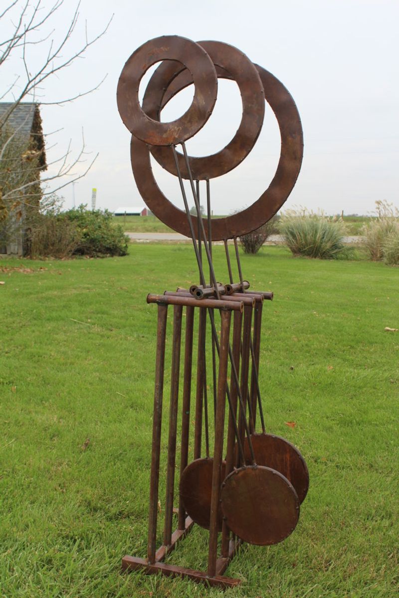 10 Outdoor Decorating Moves Texans Swear By This Year - Decor Hint Mix-and-Match Metal Sculptures or Yard Art