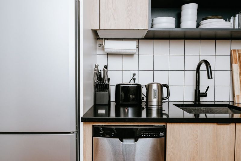 16 Items That Make Your Kitchen Look Cheap, According To Professionals (Plus 8 To Get Rid Of ASAP) - Decor Hint Visible Cords and Outlets (GET RID OF ASAP)