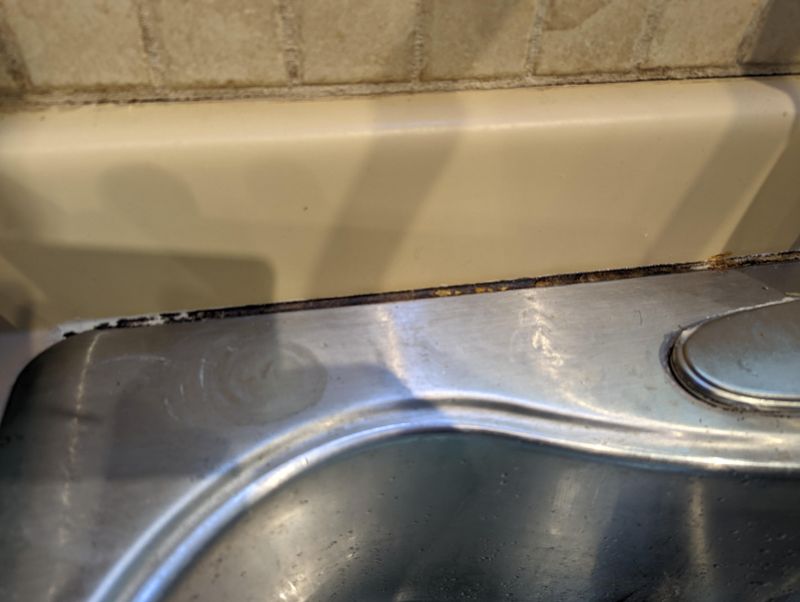 29 Kitchen "Icks" That Immediately Turn Off Homebuyers, According to Interior Designers - Decor Hint Sloppy Caulk Lines