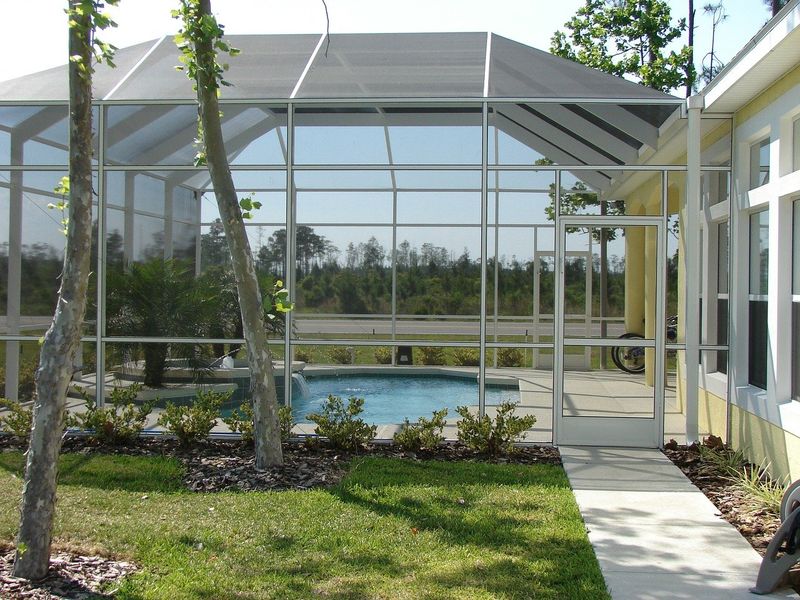 Florida's Most Loved Outdoor Nooks Everyone's Raving About - Decor Hint Screened-In Lanais With Swing Chairs