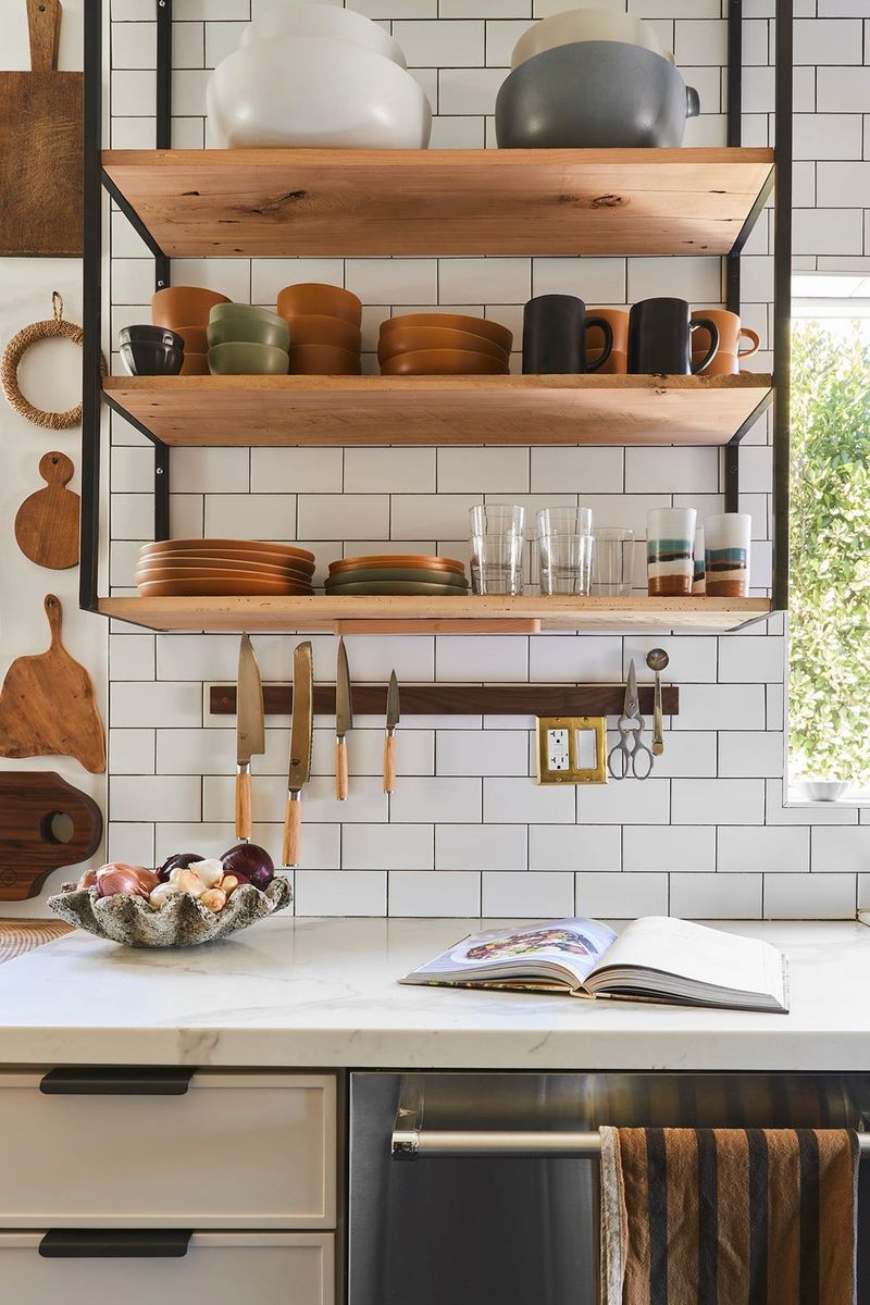 Open shelving cluttered with items (avoid)