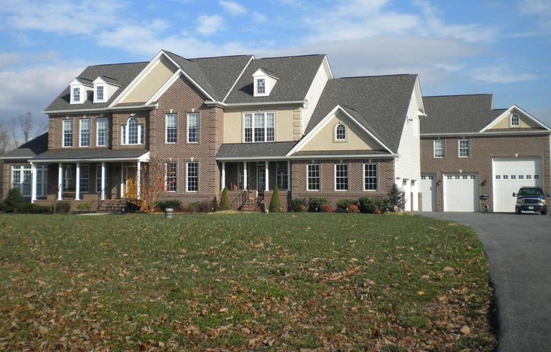 The End Of An Era: 14 Maryland Home Styles Becoming Obsolete By 2030 - Decor Hint McMansion Brick And Stone Combo