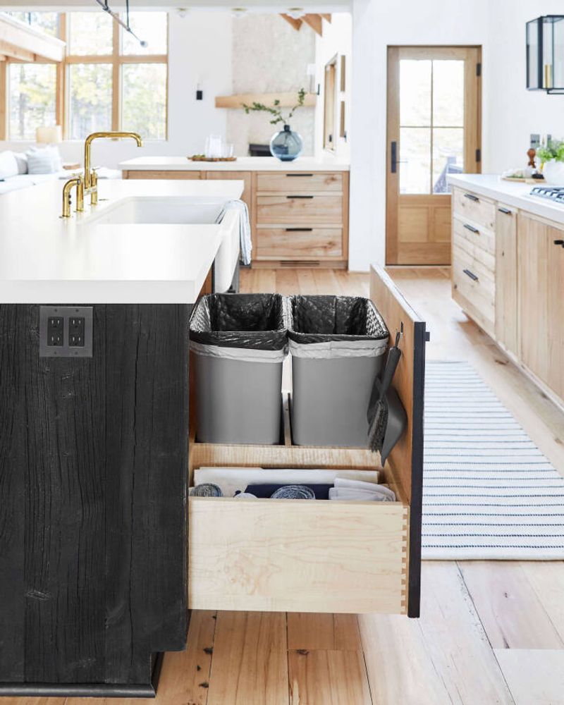 24 Clever Upgrades Designers Swear By For A High-End Kitchen Vibe - Decor Hint Hidden Trash and Recycling Pull-Outs