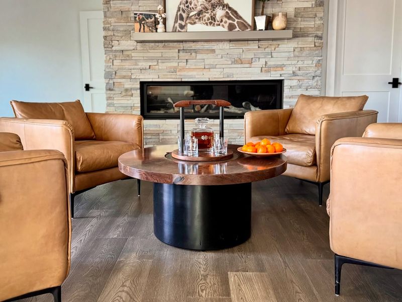 Leather Armchairs Paired with Wood-and-Metal Accents