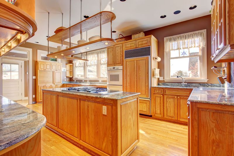 11 Outdated Kitchen Trends In Kentucky, And 9 Classics That Never Go Out Of Style - Decor Hint Overuse Of Oak Wood Tones Creates Honey-Colored Overload