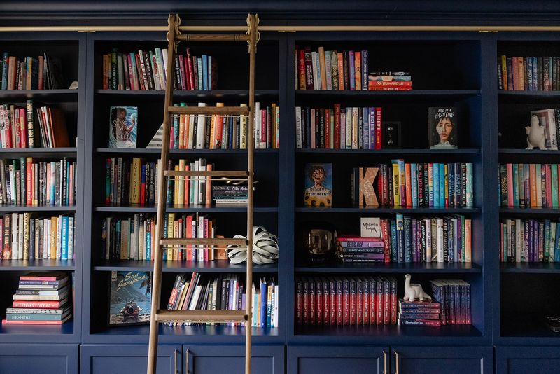 12 Invisible Mistakes Making Your Home Look Cluttered - Decor Hint Overstuffed Bookshelves