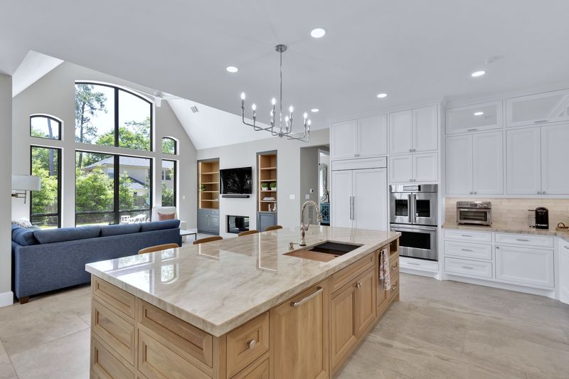 19 Diverse Examples That Say White Is The Best Color For Kitchen Cabinets - Decor Hint Creates a Cohesive Open Floor Plan