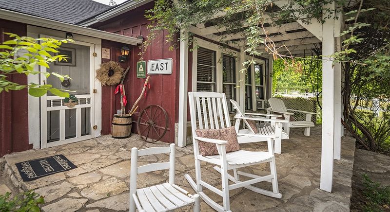 Wide Front Porches with Wood Rocking Chairs