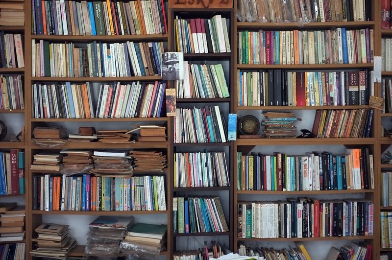 12 Household Items To Ditch After 60 And 7 You Shouldn't Have Had In The First Place - Decor Hint Overstuffed Bookcases
