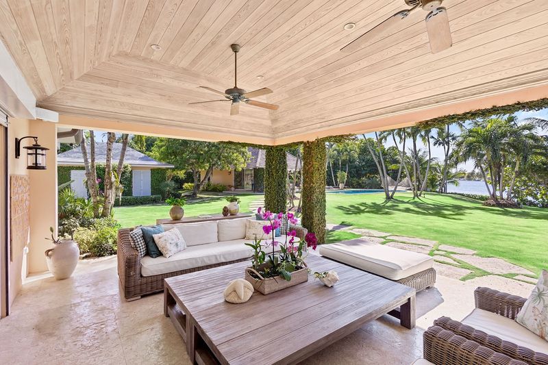 8 Backyard Design Moves That Make Florida Homes Feel Like Resorts - Decor Hint Add a Covered Lanai with Outdoor Fans