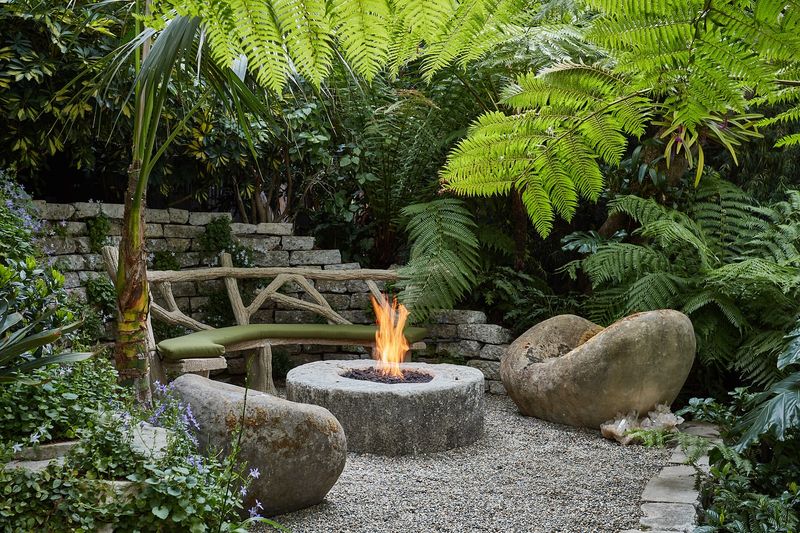 11 Gorgeous Garden Benches For Your Backyard Escape - Decor Hint Stone Seat Sanctuary