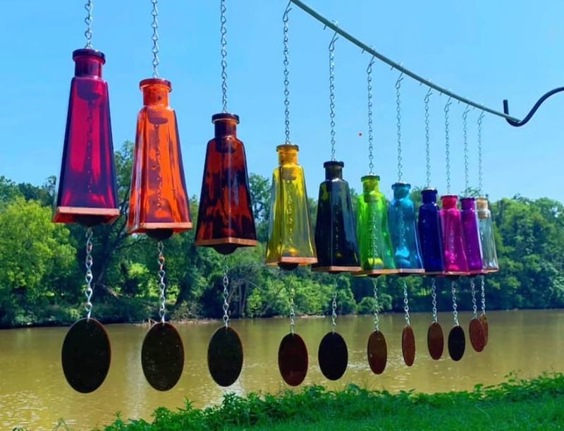 These 20 Garden Decor Ideas Are The Little Details That Will Make The Biggest Difference In Your Outdoor Space - Decor Hint Hanging Glass Bottle Vases