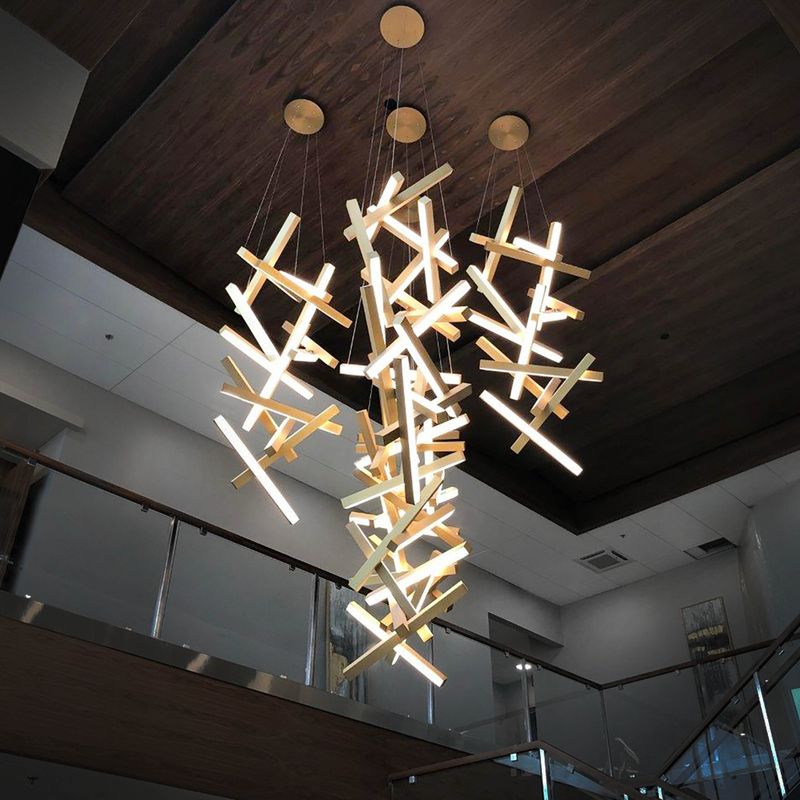 16 Things You Should Always Buy For Your Home, According To Interior Designers (Plus 5 Secret Gems) - Decor Hint Statement Light Fixture