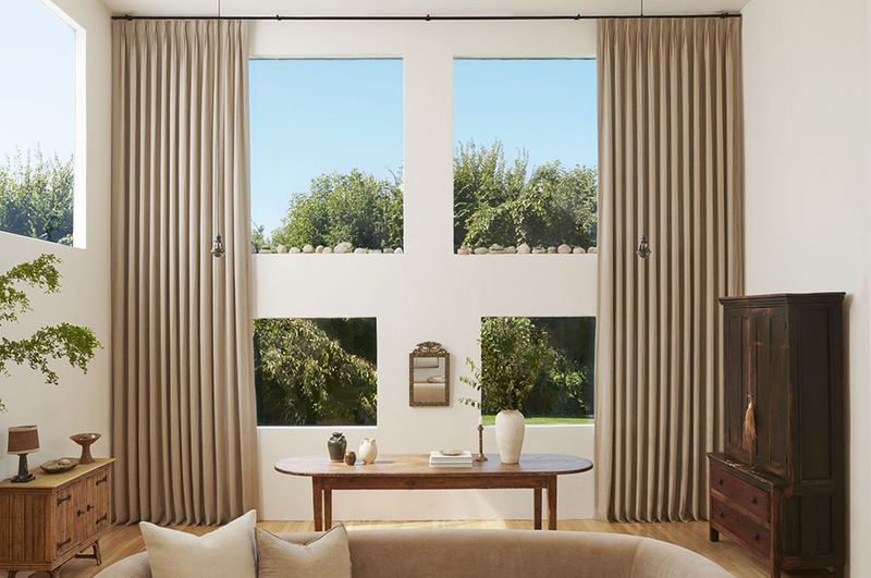 18 Gorgeous Window Treatment Ideas From Joanna Gaines You'll Want To Steal - Decor Hint Floor-To-Ceiling Drapery Panels