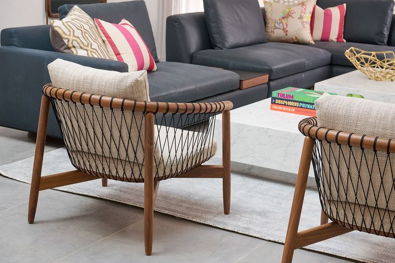 7 Design Mistakes Making Your Home Feel Smaller - Decor Hint Tiny Rugs Floating in Spaces