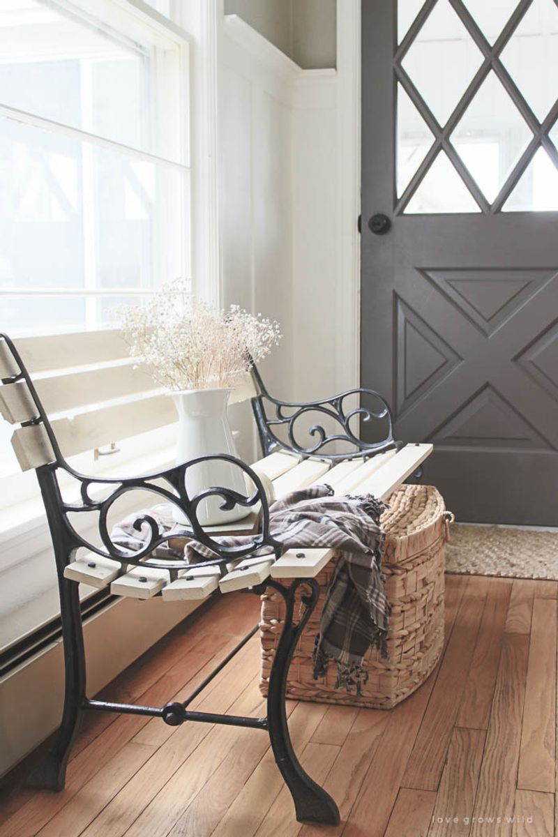 14 Entryway Ideas That Instantly Elevate Georgia Homes - Decor Hint Wrought-iron bench with cushioned seating