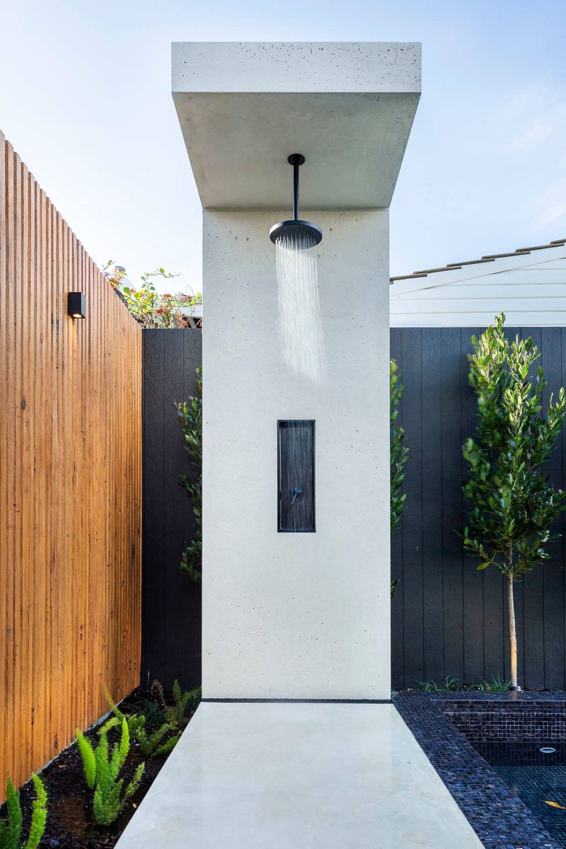 25 Outdoor Shower Ideas That Give Off BIG Beach House Energy - Decor Hint Minimalist Concrete Base