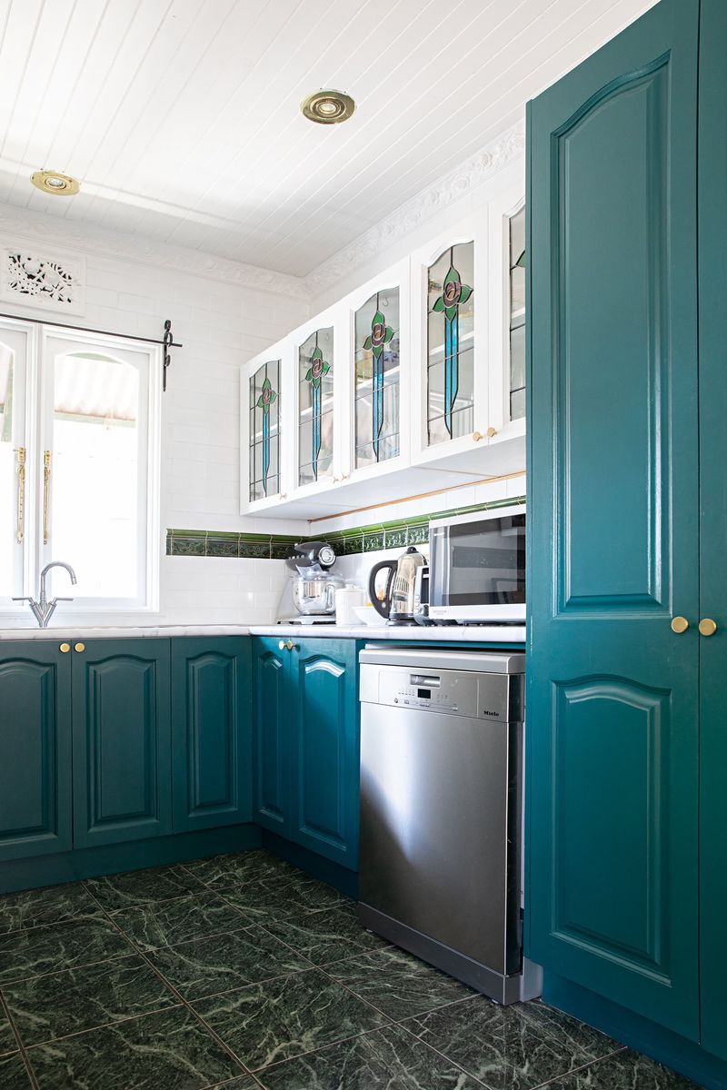 20 Outdated Kitchen Cabinet Styles Designers Say To Avoid - Decor Hint Two-Tone Upper and Lower Cabinets (with Harsh Contrast)