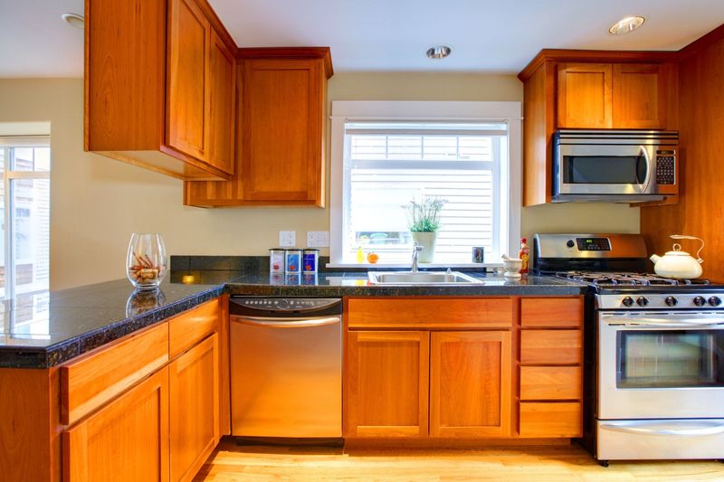 5 Outdated Kitchen Colors Alpharetta Designers Say To Skip In 2025 (And 2 That Always Work) - Decor Hint Orange-Toned Wood Stains