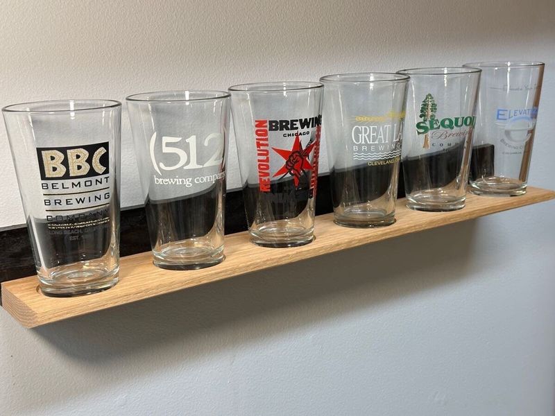 10 Warm & Welcoming Decorating Touches That Make Wisconsin Homes Truly Feel Like Home - Decor Hint Open Shelving Showcasing Wisconsin Pride