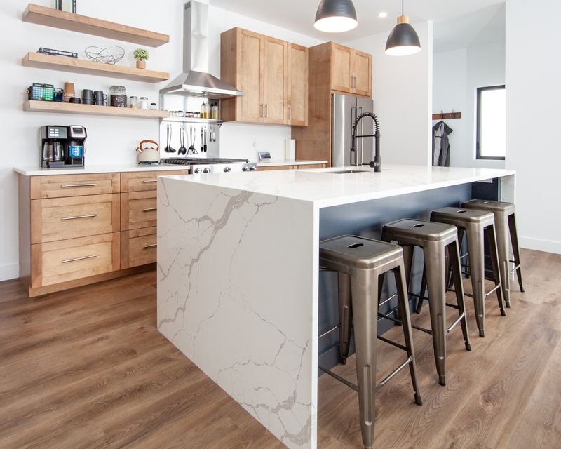 7 Things Making California Kitchens Look Cheap (Plus 7 That Instantly Elevate Them), According To Designers - Decor Hint Waterfall Quartz Islands