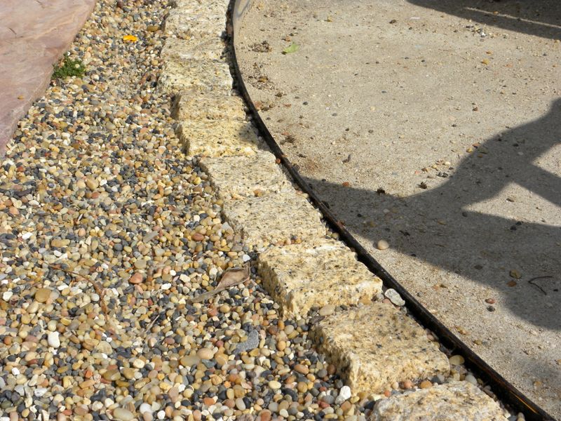 Gravel Paths Spilling into Neighbor Lawns