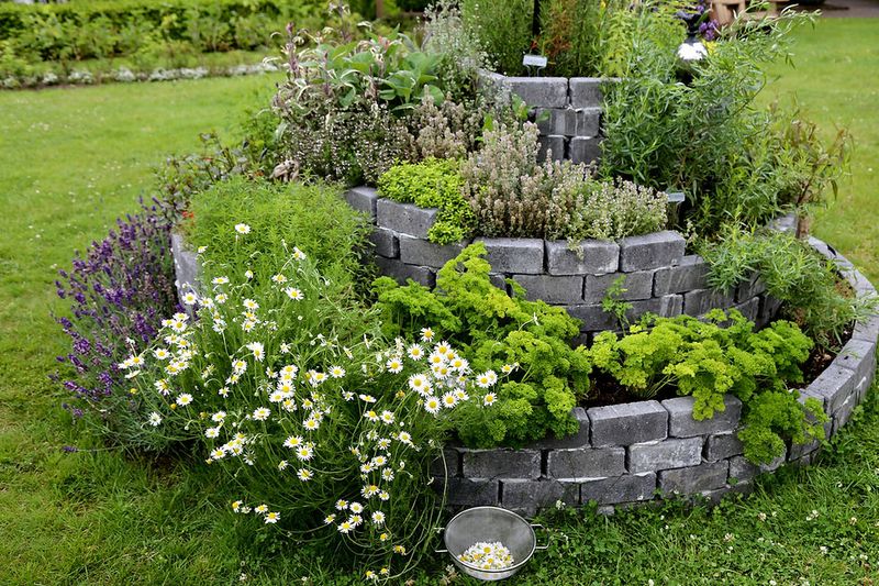 21 Sustainable Front Yard Landscaping Ideas With Rocks And Mulch - Decor Hint Rock-Edged Herb Spirals