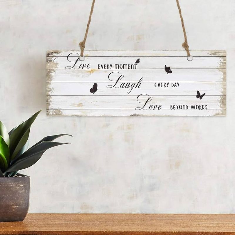 Designers Say These 20 Items Are Aging Your Home Instantly - Decor Hint Word Art Signs (“Live, Laugh, Love” Style)