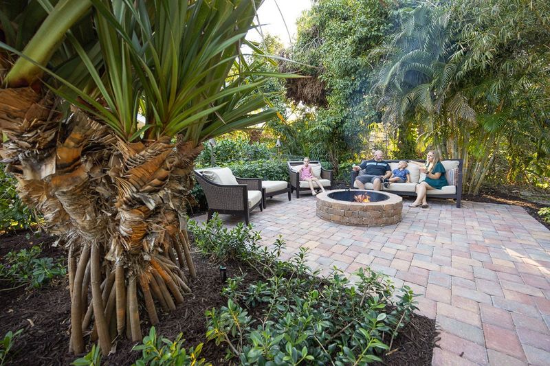 12 Stunning Outdoor Spaces Turning Heads Across Florida Neighborhoods - Decor Hint Fire Pit Seating Areas Surrounded By Tropical Plants