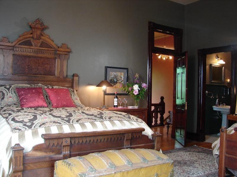 Take A Peek Inside This Stunning 1885 Brick Estate In Saint Joseph - Decor Hint Quirky Guest Bedroom Once Housed A Famous Outlaw