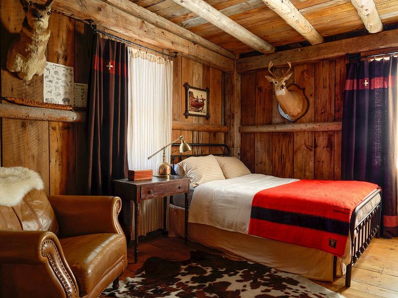 Step Inside A Tiny House Apartment That Radiates Classic American Charm - Decor Hint Lofted Sleeping Quarters With Rustic Beams