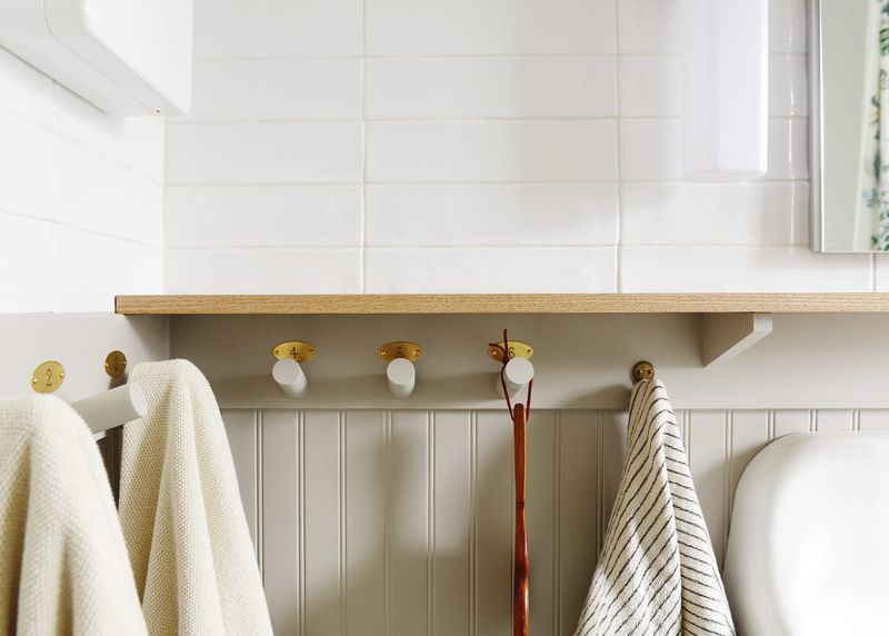 19 Smart Ways To Use That Space Above The Toilet - Decor Hint Hooks For Robes Or Towels