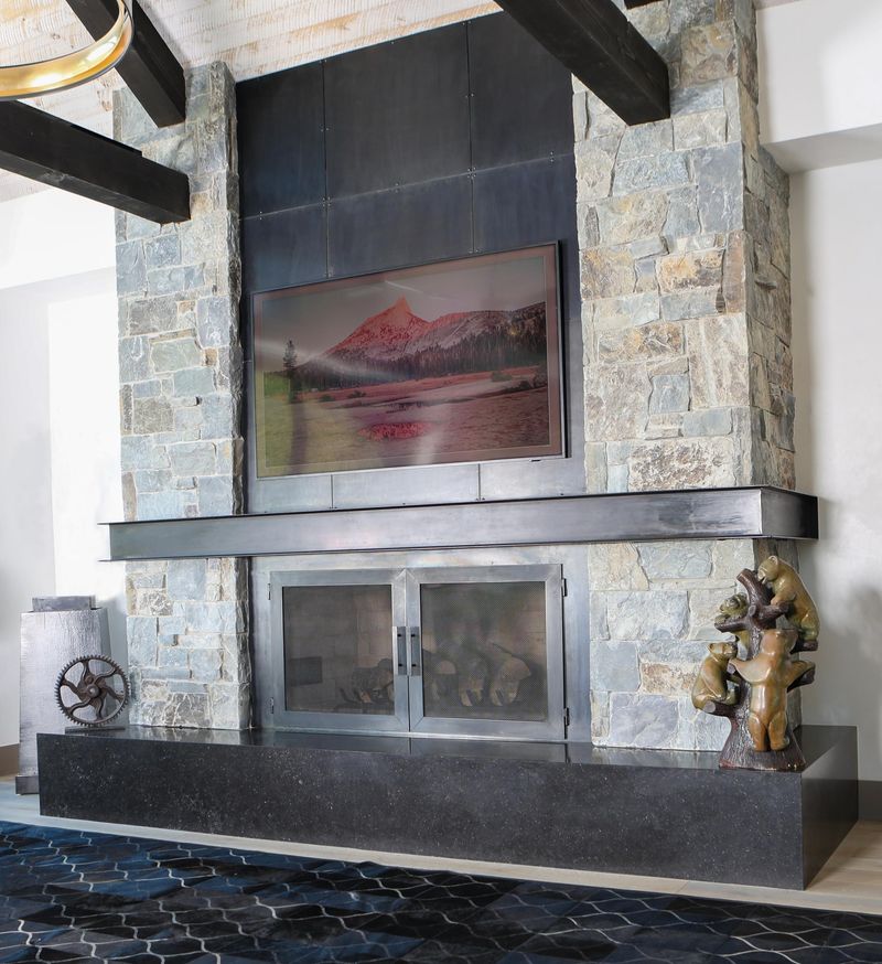 22 Fancy Barndominium Homes That Beautifully Mix Rustic With Modern - Decor Hint Floor-to-Ceiling Fireplace with Steel Mantel