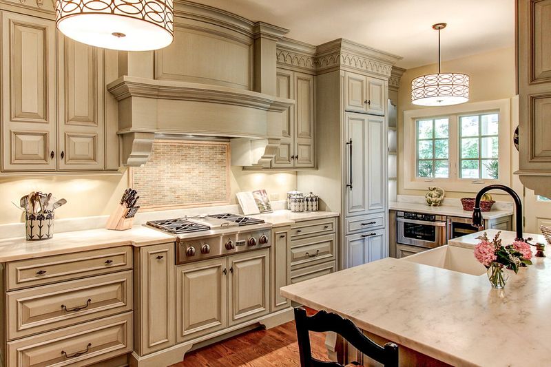 20 Outdated Kitchen Cabinet Styles Designers Say To Avoid - Decor Hint Raised Panel Doors with Ornate Trim