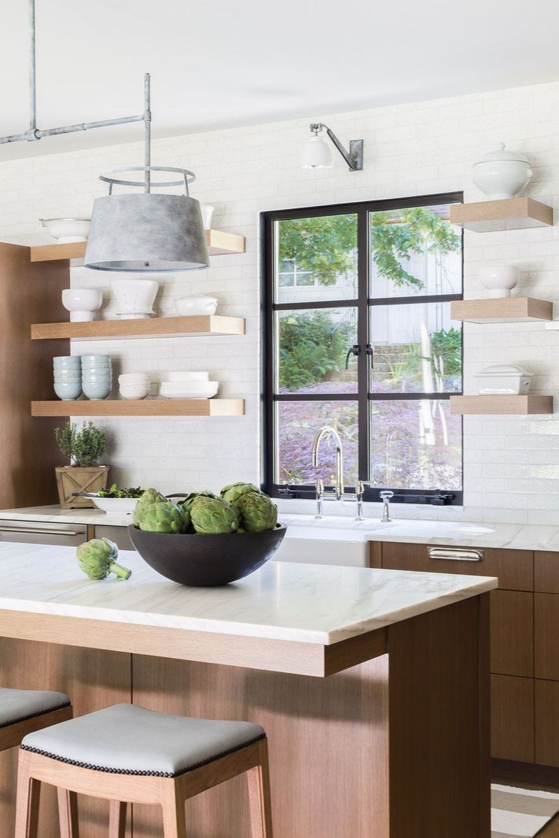 Portland Designers Share 6 Kitchen Features To Avoid And 6 That Instantly Elevate The Look - Decor Hint Open shelving with clean styling (elevate)