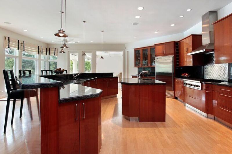 Dark Granite Paired With Cherry Cabinets