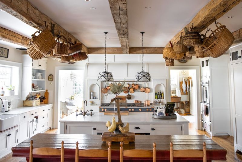 Small Yet Clever 10 Farmhouse Homes Show Off Brilliant Overhead Storage Ideas - Decor Hint Suspended Wire Baskets from Rafters