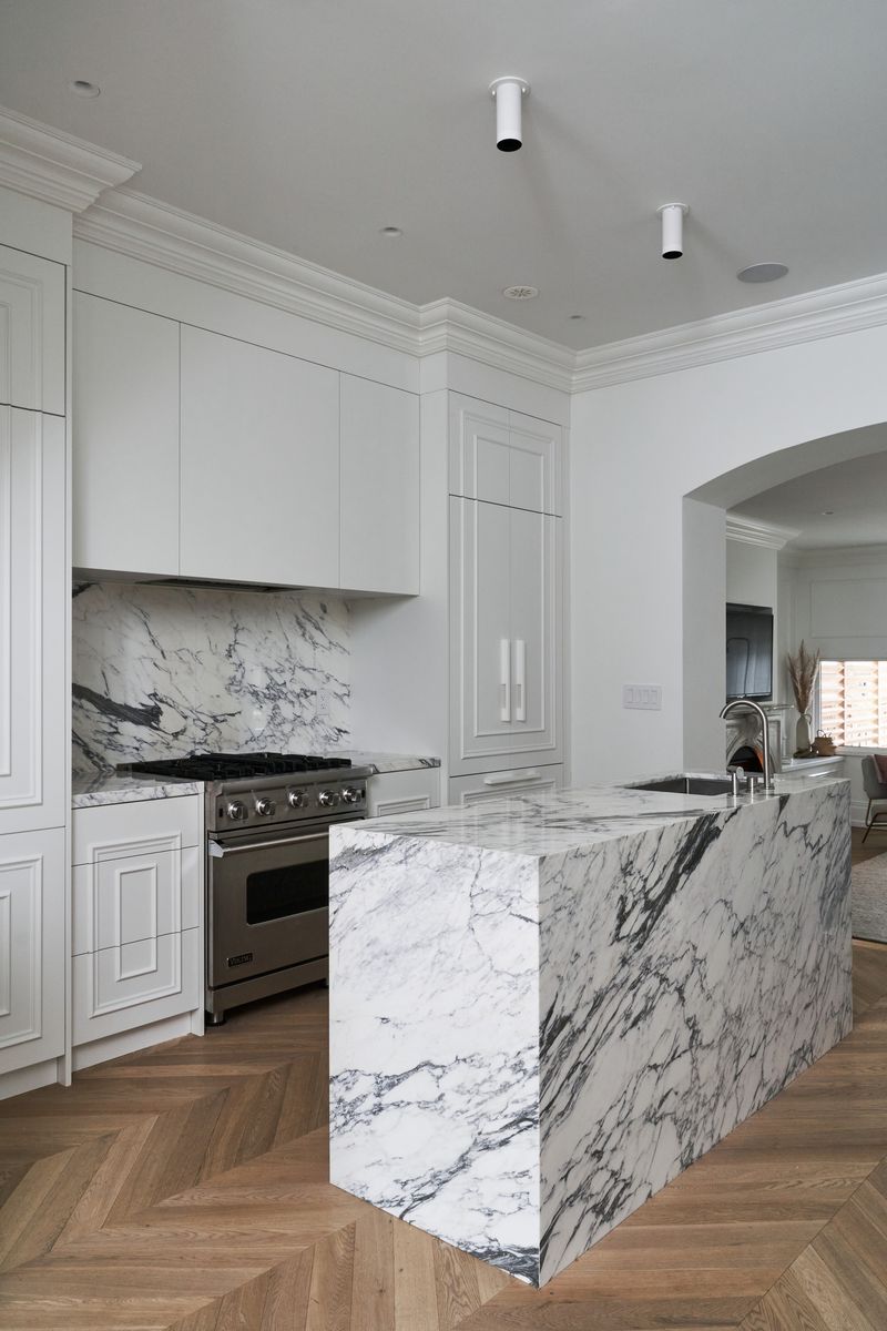 13 White Kitchens That Prove Minimalism Is Here To Stay - Decor Hint White Marble Waterfall Island